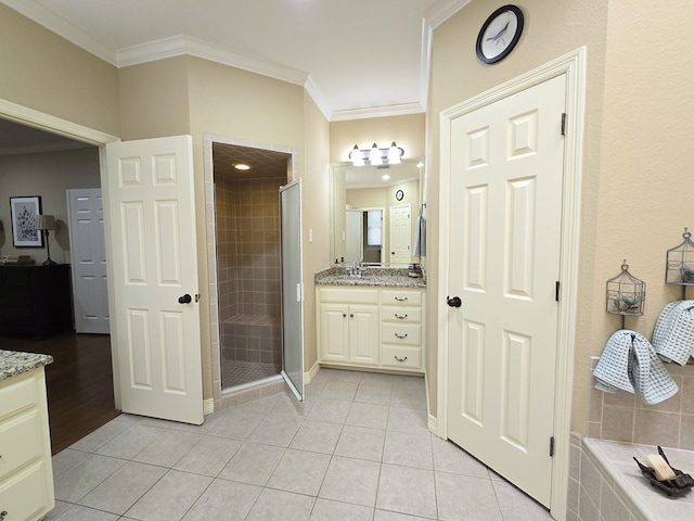 4808 W Cherrywood Ct W, Midland, TX 79707 - bathroom with vanity, a stall shower, ornamental molding, tile patterned flooring, and baseboards