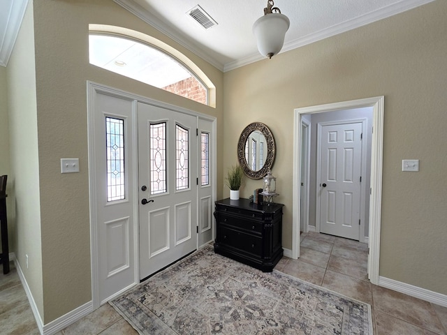 4808 W Cherrywood Ct W, Midland, TX 79707 - entryway featuring crown molding, light tile patterned floors, and baseboards
