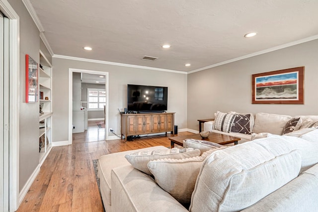 2607 N N St, Midland, TX 79705 - living room featuring recessed lighting, baseboards, light wood finished floors, and visible vents