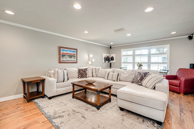 2607 N N St, Midland, TX 79705 - living room with recessed lighting, visible vents, ornamental molding, and light wood finished floors