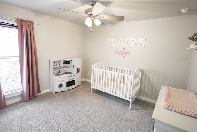 2908 Stagecoach Ct, Midland, TX 79705 - bedroom featuring carpet, a ceiling fan, and a crib