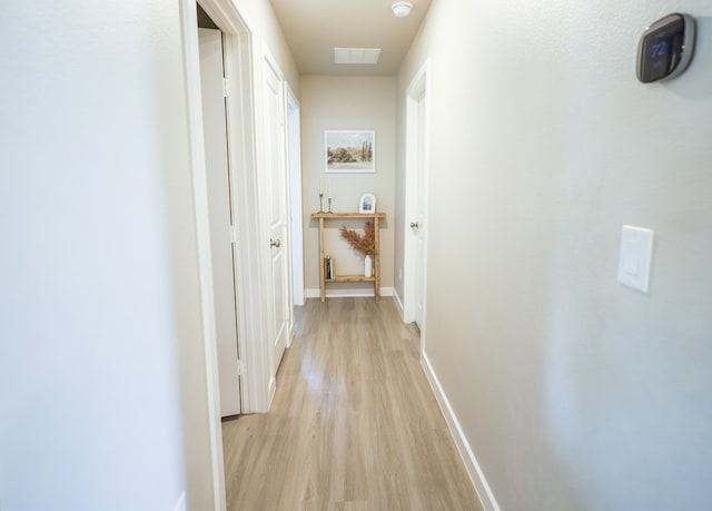 2908 Stagecoach Ct, Midland, TX 79705 - hallway featuring light wood finished floors and baseboards