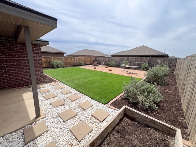 2908 Stagecoach Ct, Midland, TX 79705 - fenced backyard featuring a patio