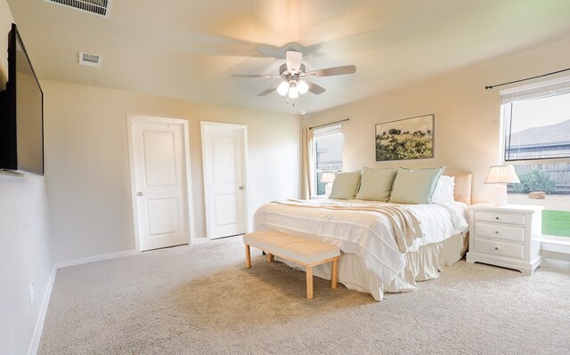 2908 Stagecoach Ct, Midland, TX 79705 - bedroom featuring light colored carpet, multiple windows, and a ceiling fan