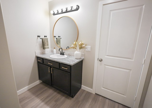 2908 Stagecoach Ct, Midland, TX 79705 - bathroom with vanity and wood finished floors