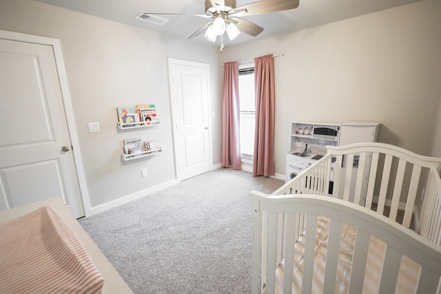 2908 Stagecoach Ct, Midland, TX 79705 - bedroom with carpet, a crib, and a ceiling fan