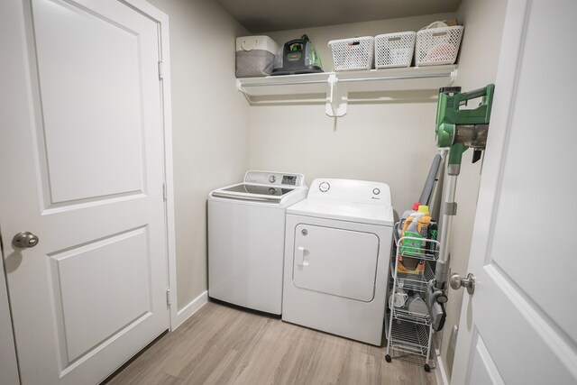 2908 Stagecoach Ct, Midland, TX 79705 - laundry area featuring washer and dryer and light wood finished floors