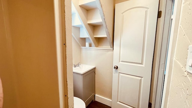 bathroom featuring vanity and toilet