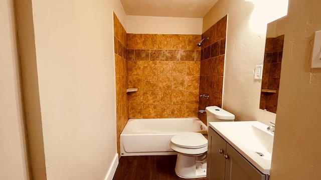 full bathroom featuring vanity, toilet, tiled shower / bath, and hardwood / wood-style flooring