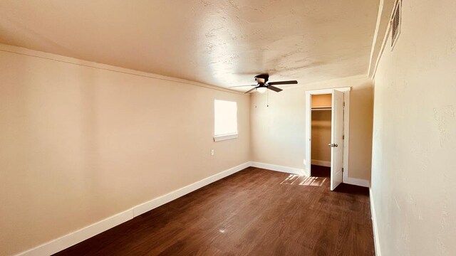 interior space featuring ceiling fan and dark hardwood / wood-style floors