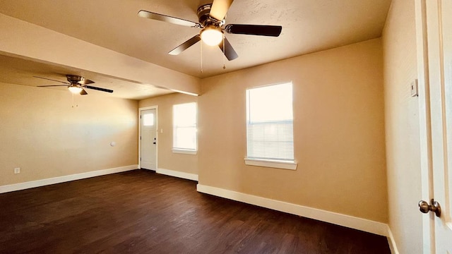 interior space with ceiling fan and dark wood-type flooring