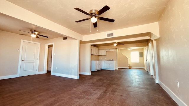 unfurnished living room with dark hardwood / wood-style floors