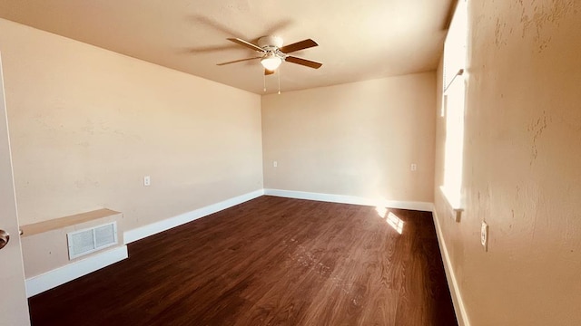 unfurnished room featuring dark hardwood / wood-style floors and ceiling fan