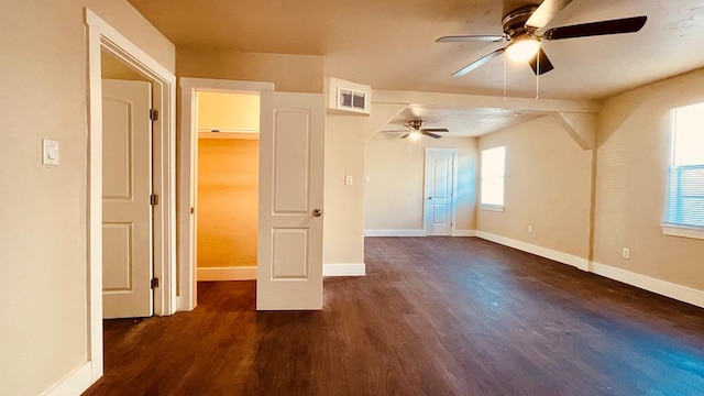 additional living space with dark wood-type flooring