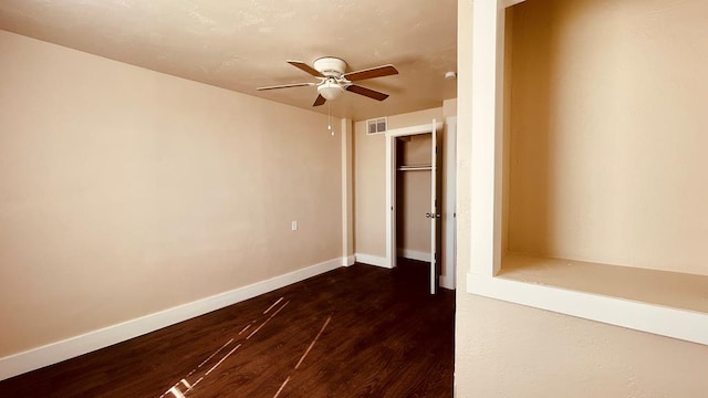 unfurnished bedroom with dark hardwood / wood-style floors and ceiling fan