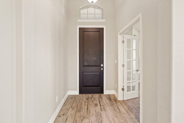 entryway with light hardwood / wood-style flooring