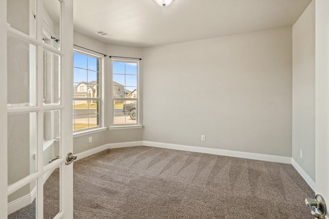 view of carpeted spare room