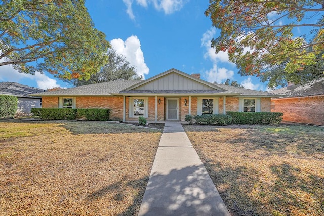 ranch-style home with a front lawn