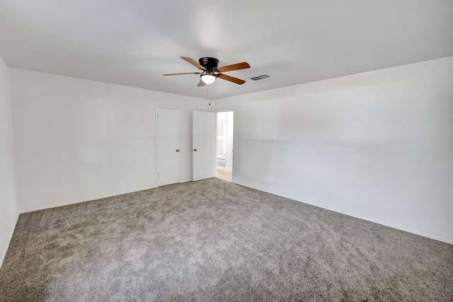 carpeted empty room with ceiling fan