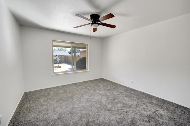 spare room with carpet flooring, ceiling fan, and a textured ceiling