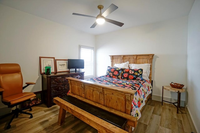 bedroom with hardwood / wood-style flooring and ceiling fan