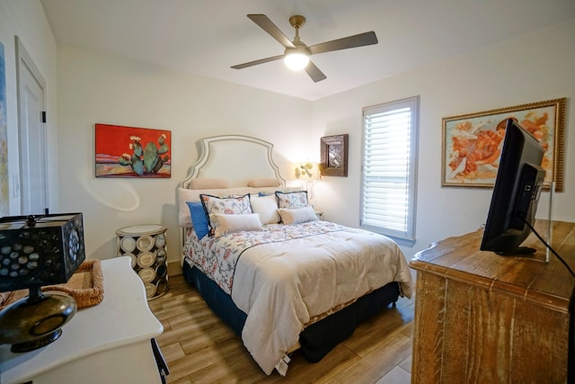 bedroom featuring ceiling fan and light hardwood / wood-style floors