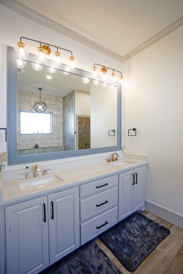 bathroom with curtained shower, vanity, wood-type flooring, and ornamental molding