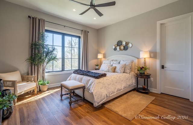 bedroom featuring ceiling fan and hardwood / wood-style floors