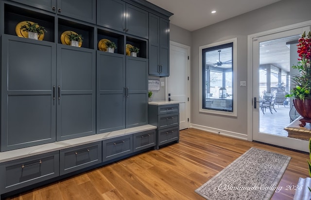 mudroom with light hardwood / wood-style floors