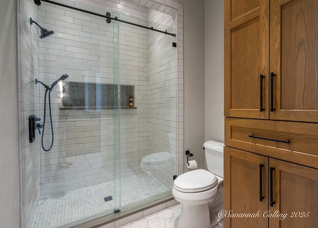 bathroom with toilet and a shower with door