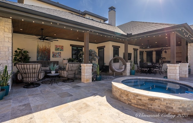 view of pool with a jacuzzi, a patio, and ceiling fan