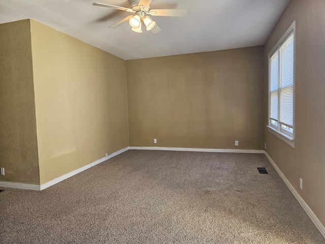 carpeted empty room with ceiling fan