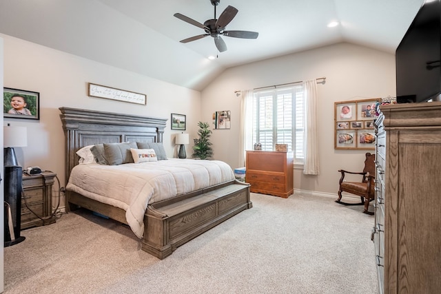 bedroom featuring ceiling fan, light carpet, and vaulted ceiling