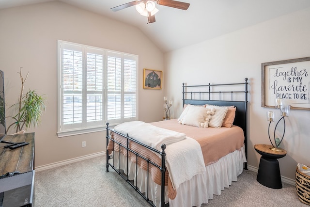 carpeted bedroom featuring ceiling fan and lofted ceiling