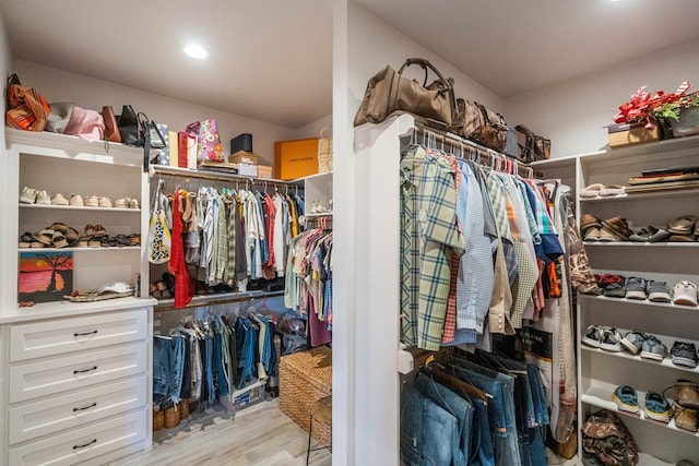 walk in closet featuring light hardwood / wood-style flooring