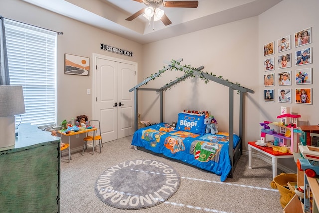 bedroom featuring ceiling fan and carpet floors