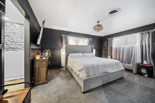 bedroom featuring dark colored carpet