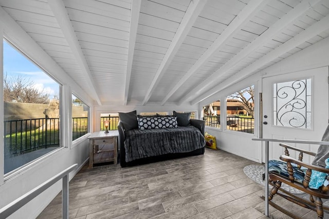 bedroom featuring lofted ceiling with beams