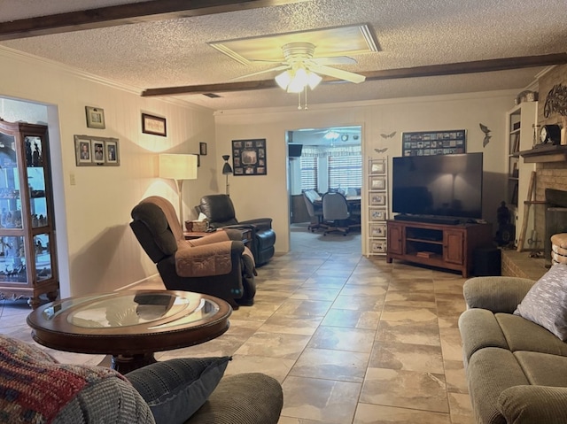 living room featuring crown molding, ceiling fan, beam ceiling, a fireplace, and a textured ceiling