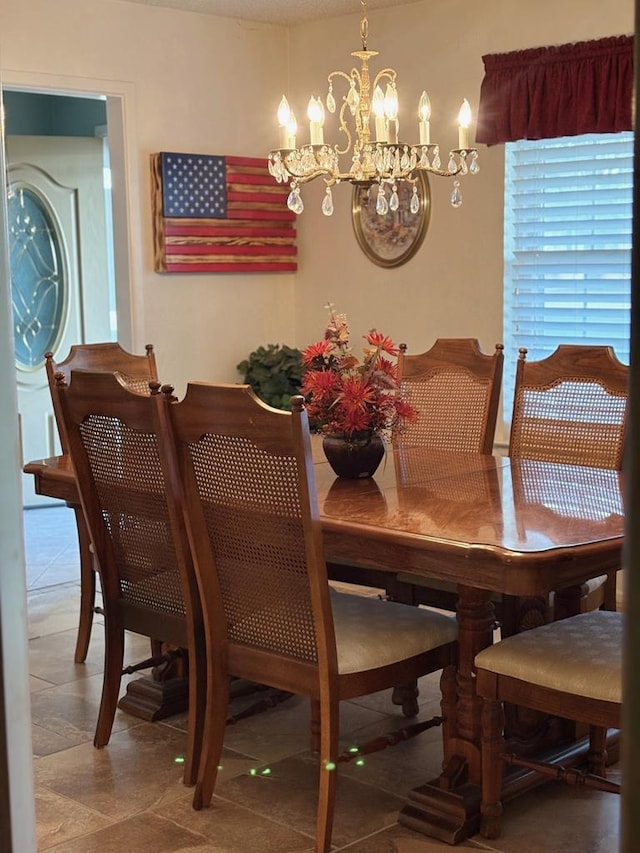 2801 Haynes Dr, Midland, TX 79705 - tiled dining space featuring a chandelier