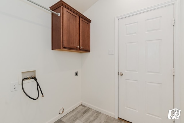 laundry area featuring hookup for a washing machine, light wood-style flooring, baseboards, cabinet space, and electric dryer hookup