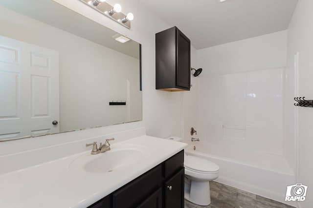 full bathroom with toilet, shower / bath combination, wood finished floors, and vanity