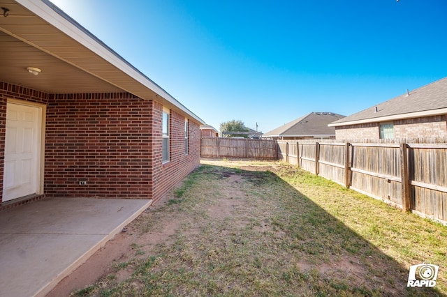 view of yard with a fenced backyard