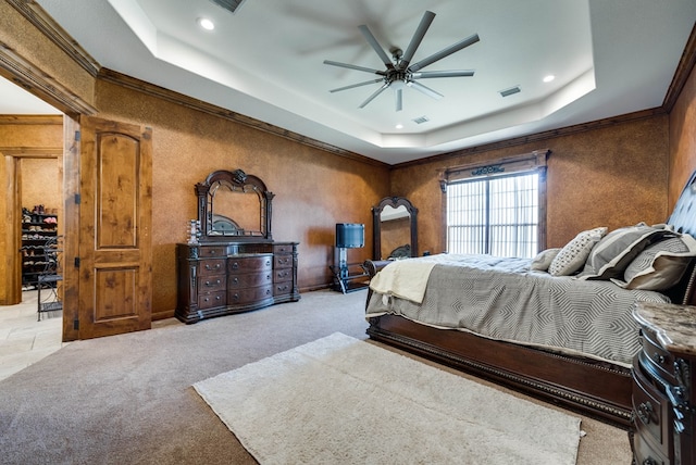 carpeted bedroom featuring ornamental molding, recessed lighting, a raised ceiling, and visible vents