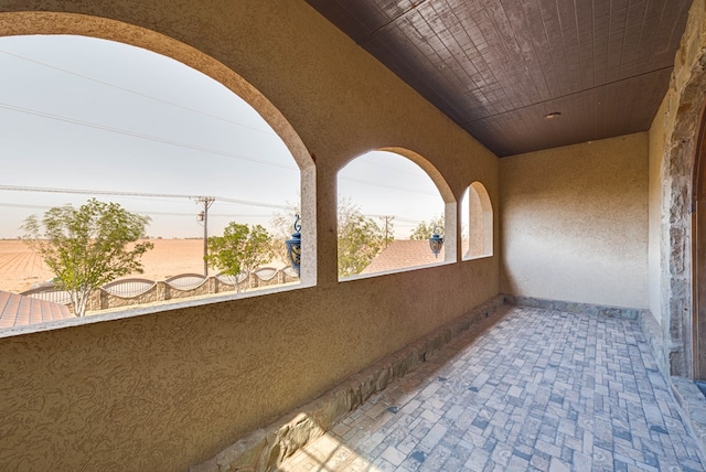 view of patio featuring a balcony