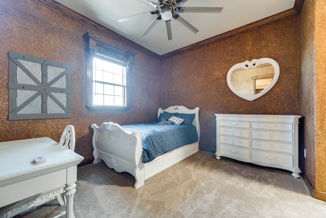 bedroom with carpet floors, crown molding, and a ceiling fan