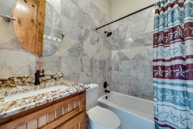 bathroom with toilet, shower / bath combo, vanity, and tile walls