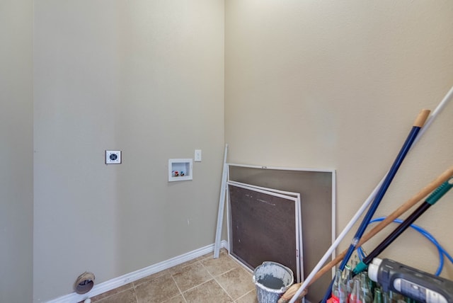 laundry room featuring laundry area, baseboards, hookup for a washing machine, tile patterned flooring, and electric dryer hookup