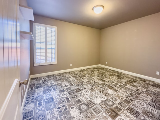 unfurnished room featuring tile patterned floors