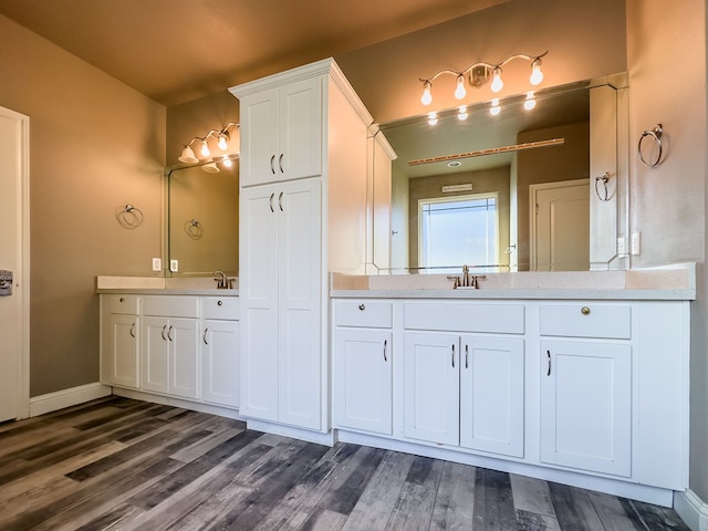 bathroom featuring vanity and hardwood / wood-style flooring